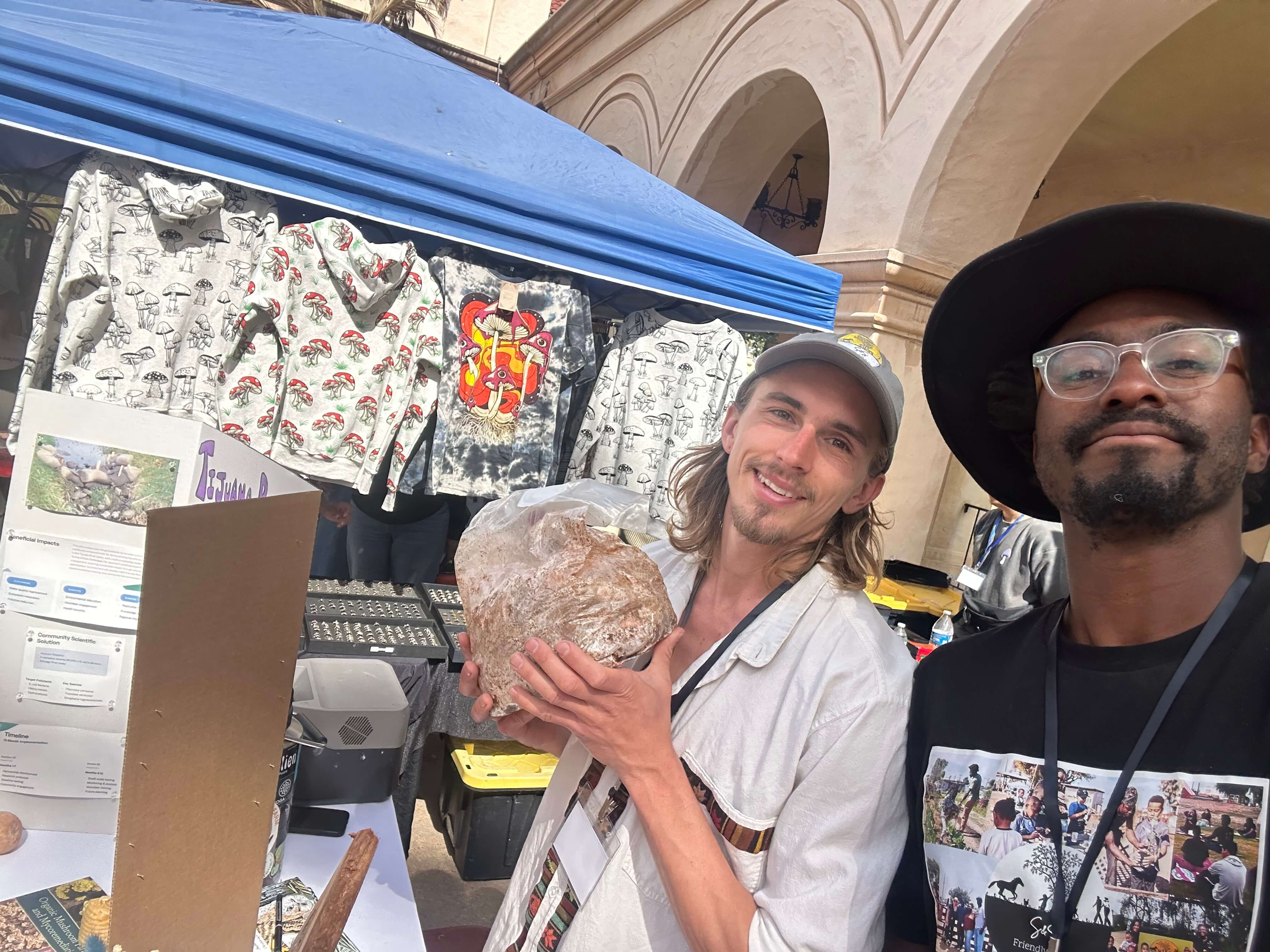 Jake and Frank at a mushroom fair booth